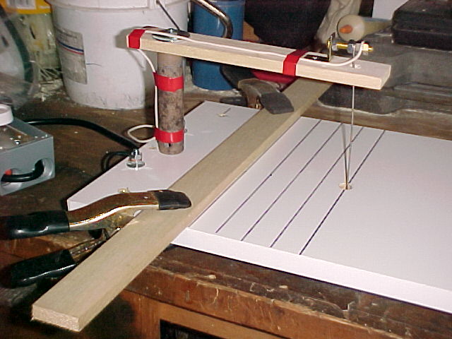 board calmped to the base of foam cutter to act as a cutting fence.jpg